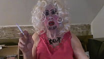CD Sissy Sarah Millward knows her ID, as indicated by what's written on her face and chest - 'fag slut' -   as she smokes, wanks her clit, and stuffs a dildo up her nasty lady hole
